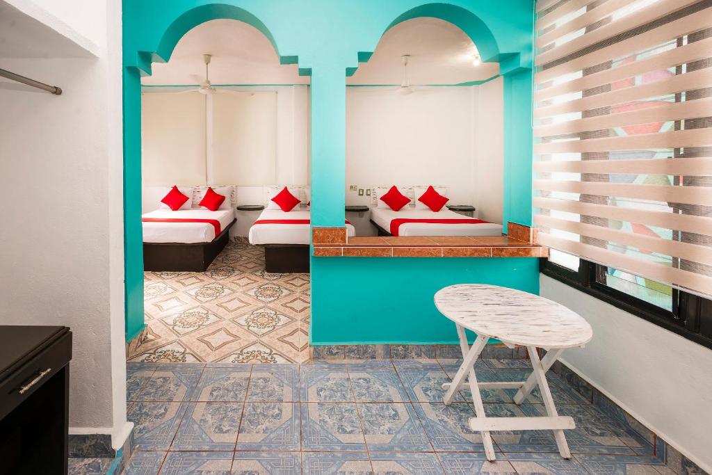 Postel nebo postele na pokoji v ubytování Hotel América