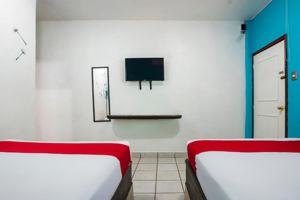 Postel nebo postele na pokoji v ubytování Hotel América