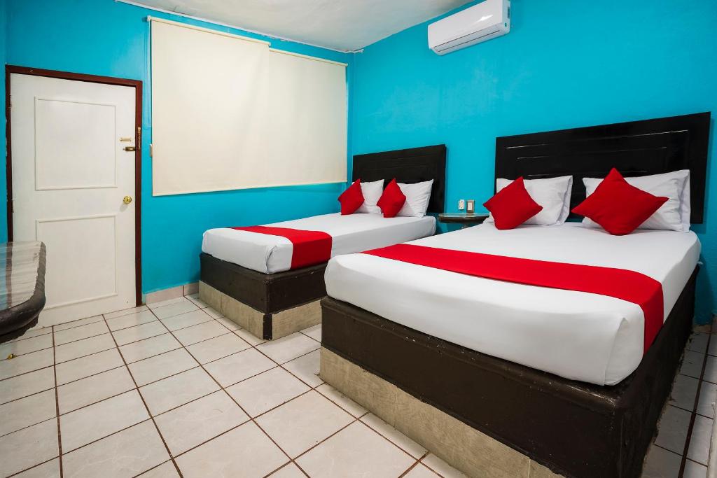 Postel nebo postele na pokoji v ubytování Hotel América