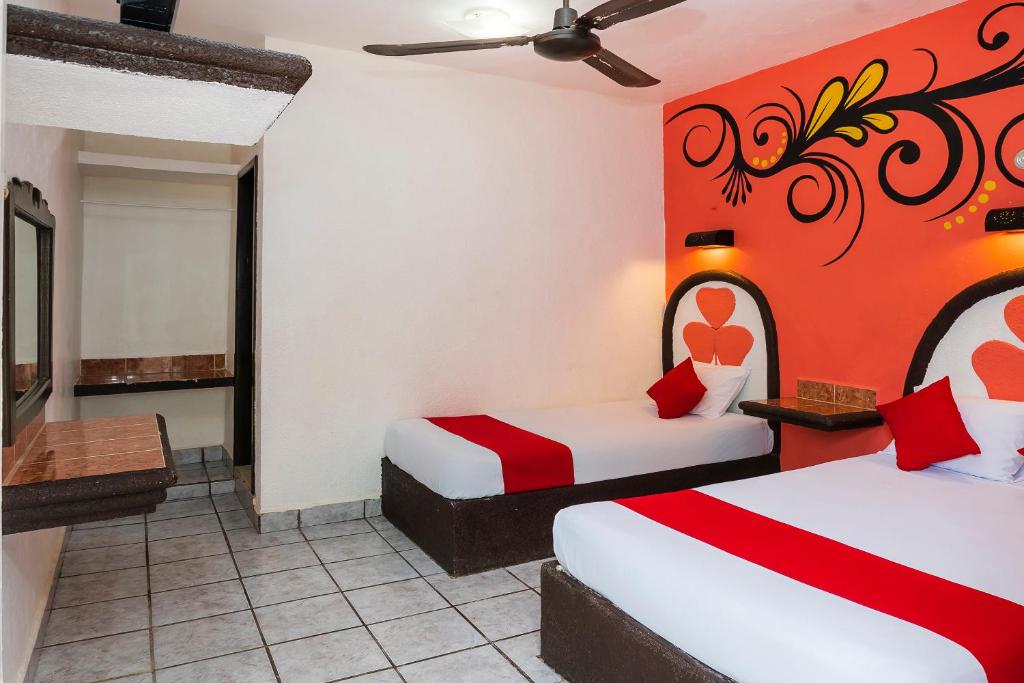 Postel nebo postele na pokoji v ubytování Hotel América