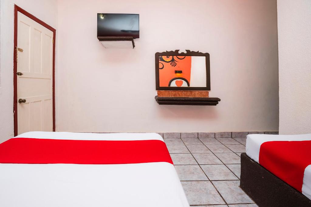 Postel nebo postele na pokoji v ubytování Hotel América