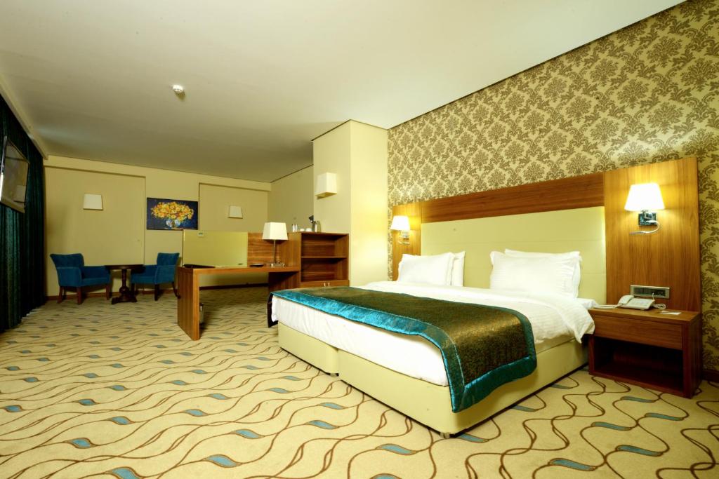 Postel nebo postele na pokoji v ubytování Margi Hotel