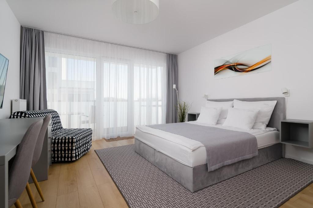 Ένα ή περισσότερα κρεβάτια σε δωμάτιο στο Apartament "Sevach" Kołobrzeg
