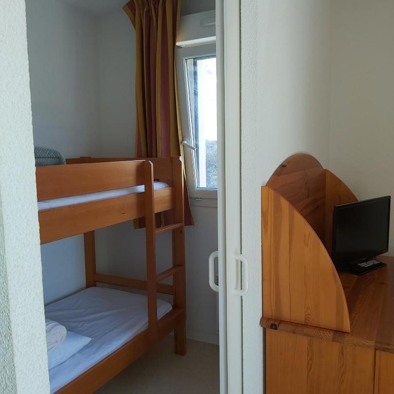 Postel nebo postele na pokoji v ubytování Résidence mille soleils