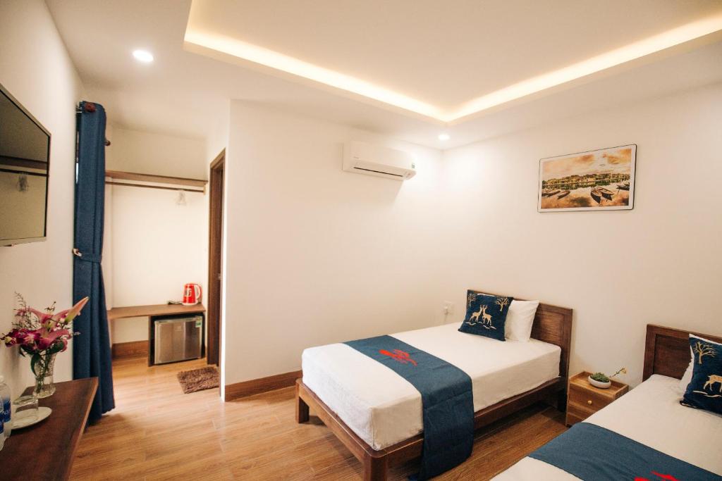 Postel nebo postele na pokoji v ubytování THE VIEW HOMESTAY HỘI AN