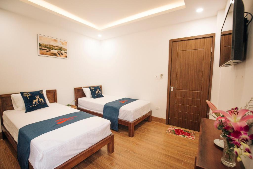 Postel nebo postele na pokoji v ubytování THE VIEW HOMESTAY HỘI AN