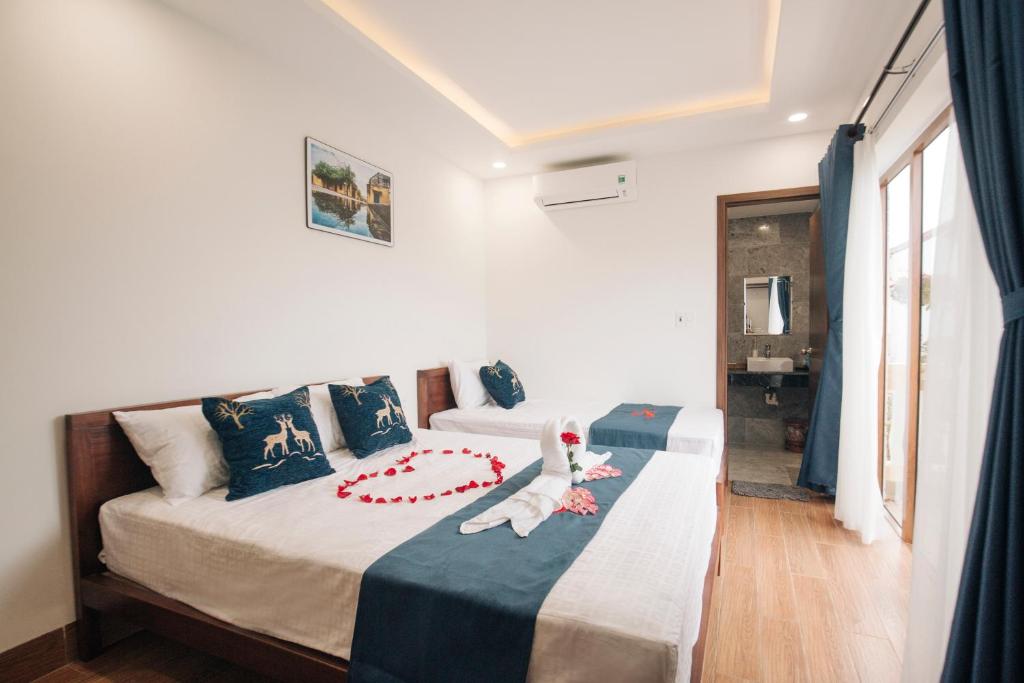 Postel nebo postele na pokoji v ubytování THE VIEW HOMESTAY HỘI AN