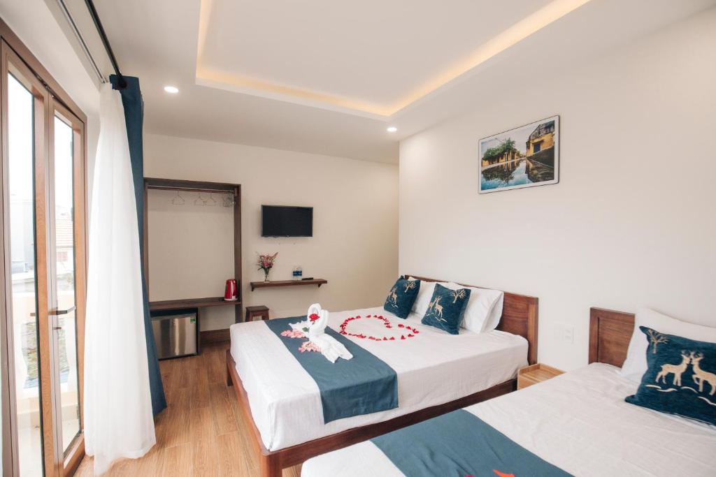 Postel nebo postele na pokoji v ubytování THE VIEW HOMESTAY HỘI AN