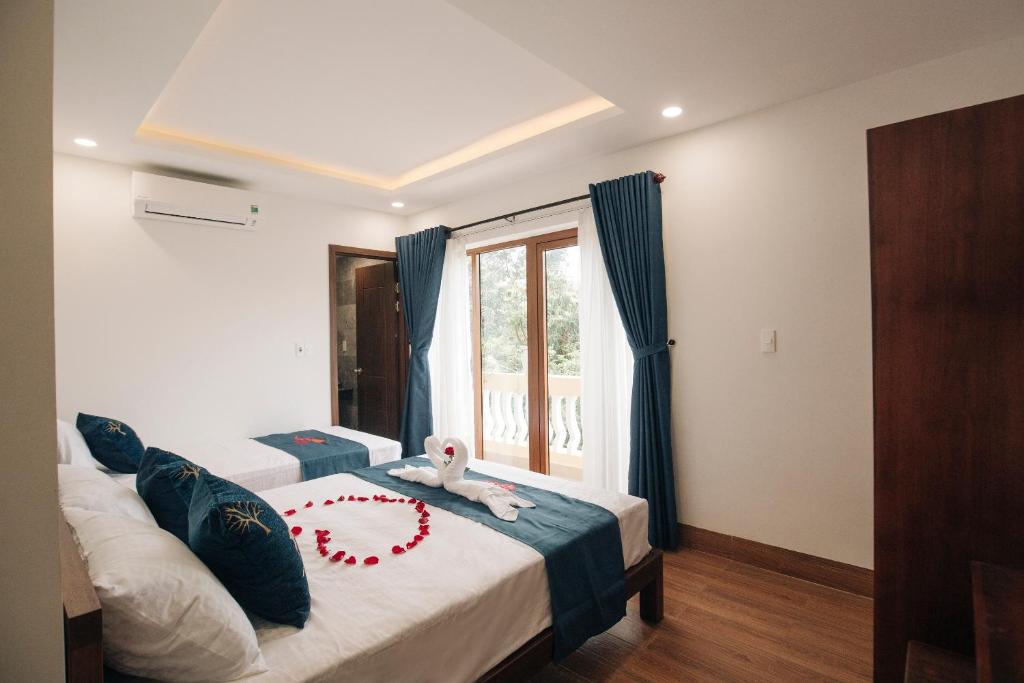 Postel nebo postele na pokoji v ubytování THE VIEW HOMESTAY HỘI AN