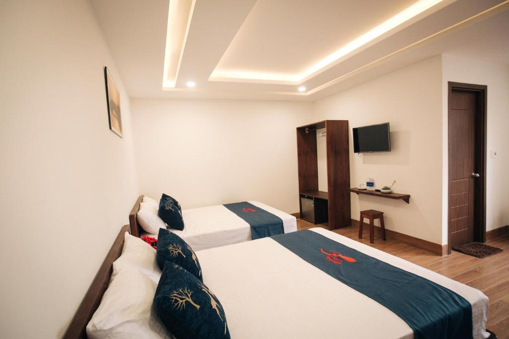 Postel nebo postele na pokoji v ubytování THE VIEW HOMESTAY HỘI AN