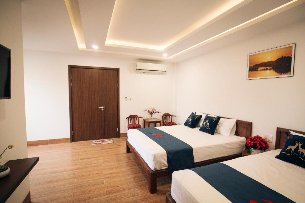 Postel nebo postele na pokoji v ubytování THE VIEW HOMESTAY HỘI AN