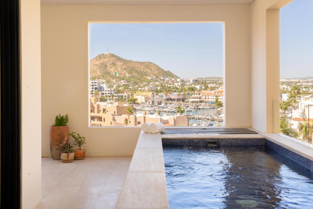 a swimming pool in a house with a view at 1 Homes Preview Cabo in Cabo San Lucas