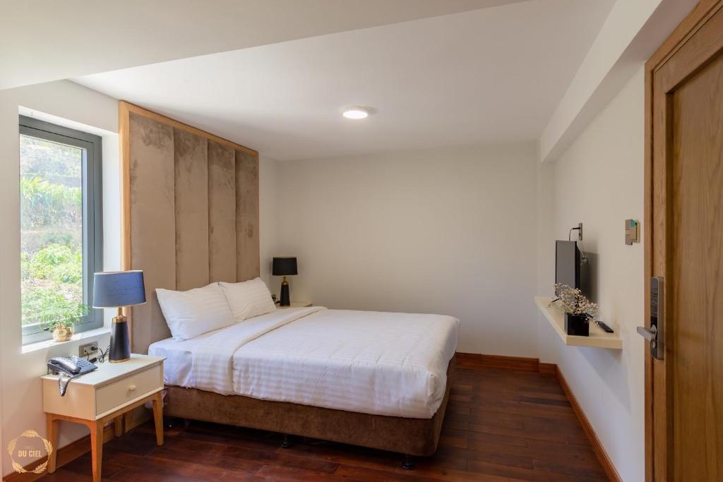 Postel nebo postele na pokoji v ubytování Hotel Du Ciel
