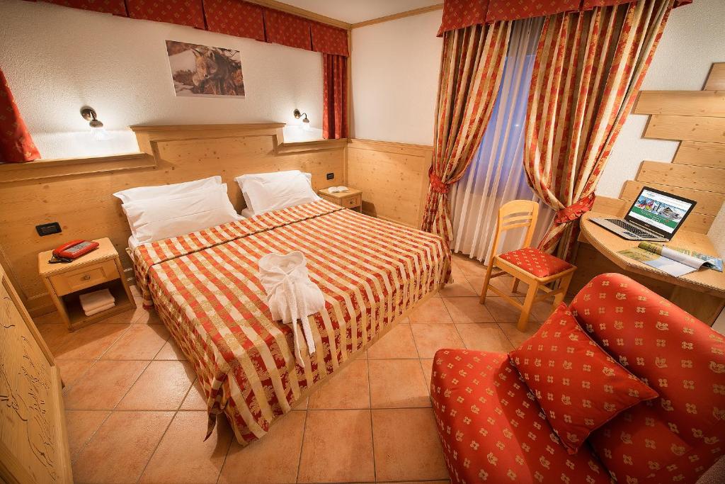 Postel nebo postele na pokoji v ubytování Hotel Bucaneve