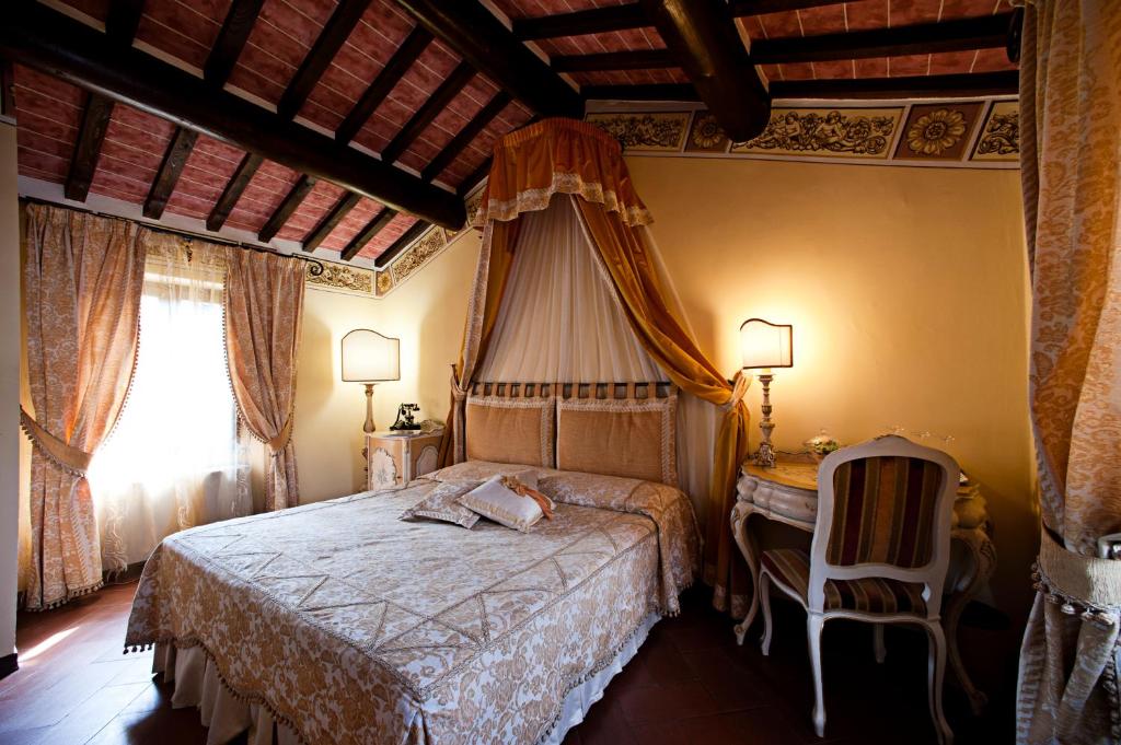 Posteľ alebo postele v izbe v ubytovaní Relais La Corte dei Papi