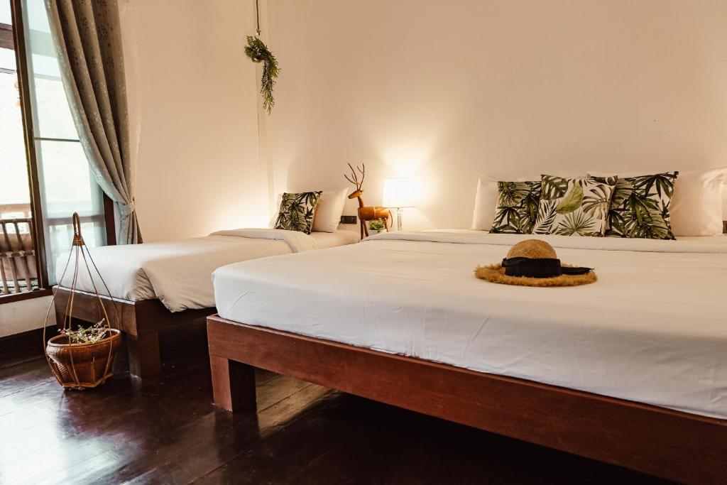 Postel nebo postele na pokoji v ubytování À La Koh Kood Resort