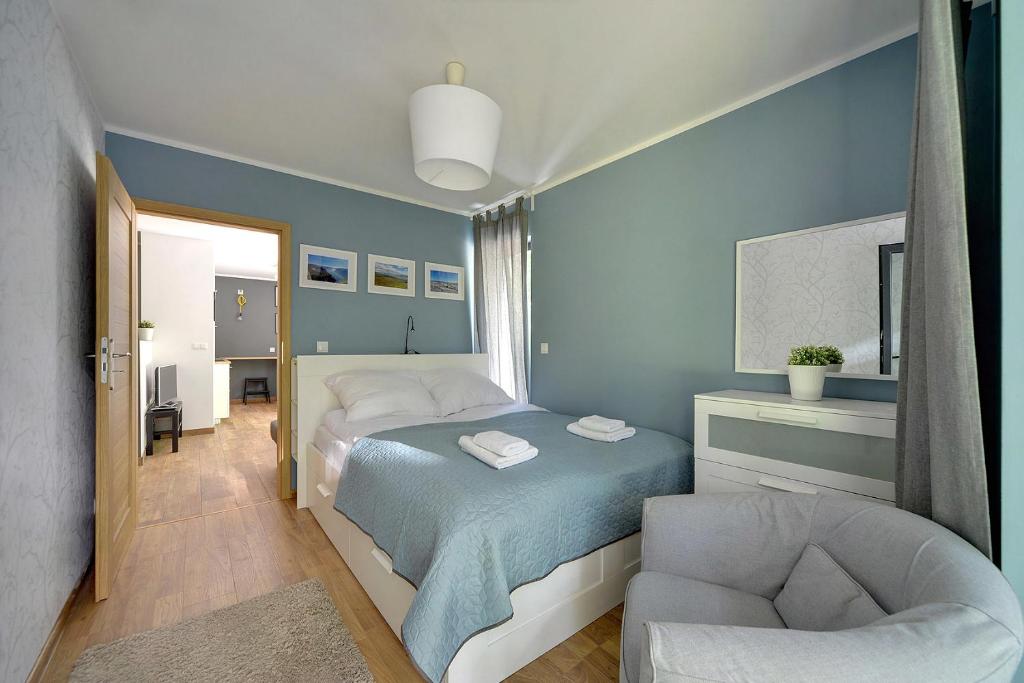 Postel nebo postele na pokoji v ubytování Ekskluzywne Apartamenty Sun Seasons 24 w Karpaczu by Noclegi Renters