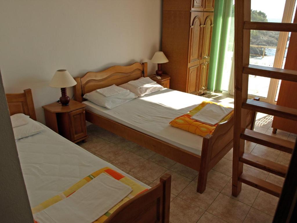 Postel nebo postele na pokoji v ubytování Arabela Apartments