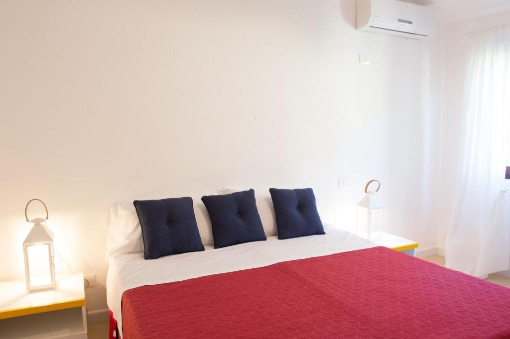 A bed or beds in a room at Terrazze di Chia