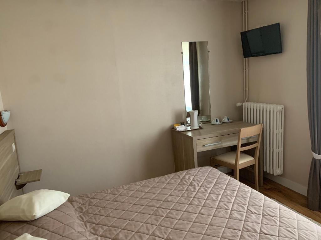 Postel nebo postele na pokoji v ubytování Au Vieux Puits