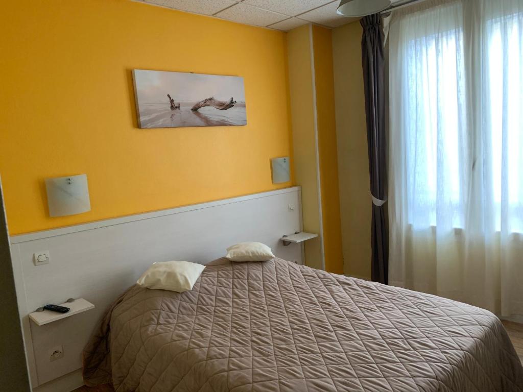 Postel nebo postele na pokoji v ubytování Au Vieux Puits
