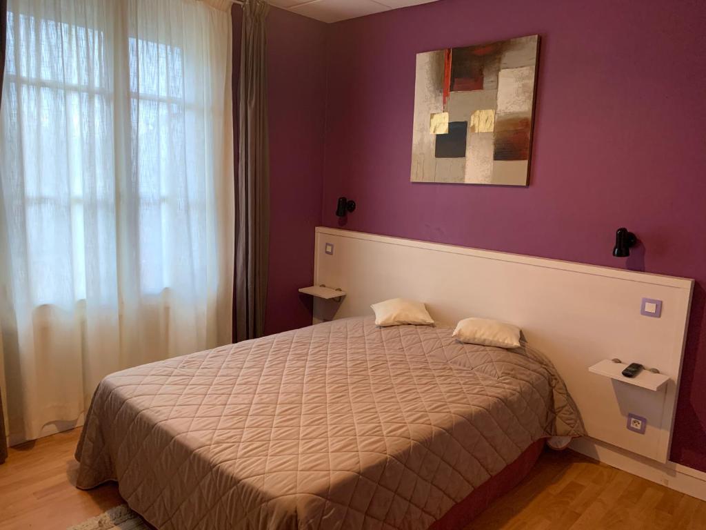 Postel nebo postele na pokoji v ubytování Au Vieux Puits