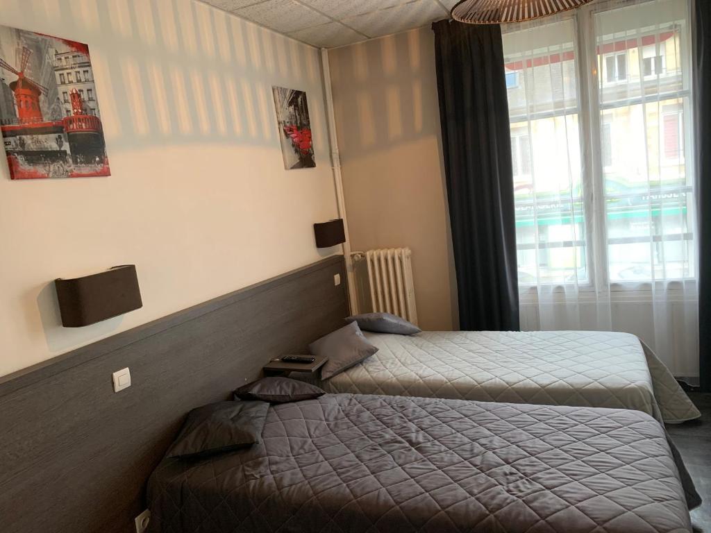 Postel nebo postele na pokoji v ubytování Au Vieux Puits