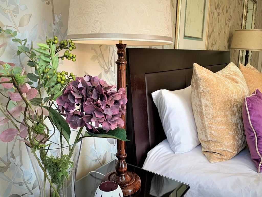 Krevet ili kreveti u jedinici u objektu Abbey Manor Luxury Guesthouse