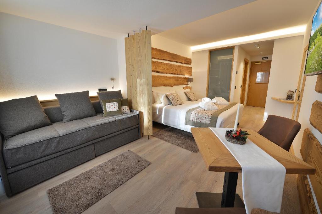 Postel nebo postele na pokoji v ubytování Hotel Bucaneve