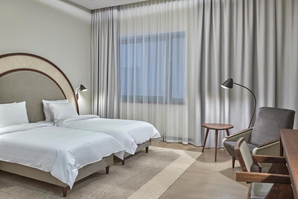 Postel nebo postele na pokoji v ubytování Neringa Hotel