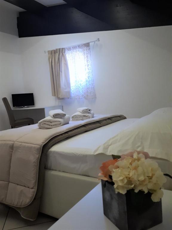 Postel nebo postele na pokoji v ubytování Villa Treglia b&b