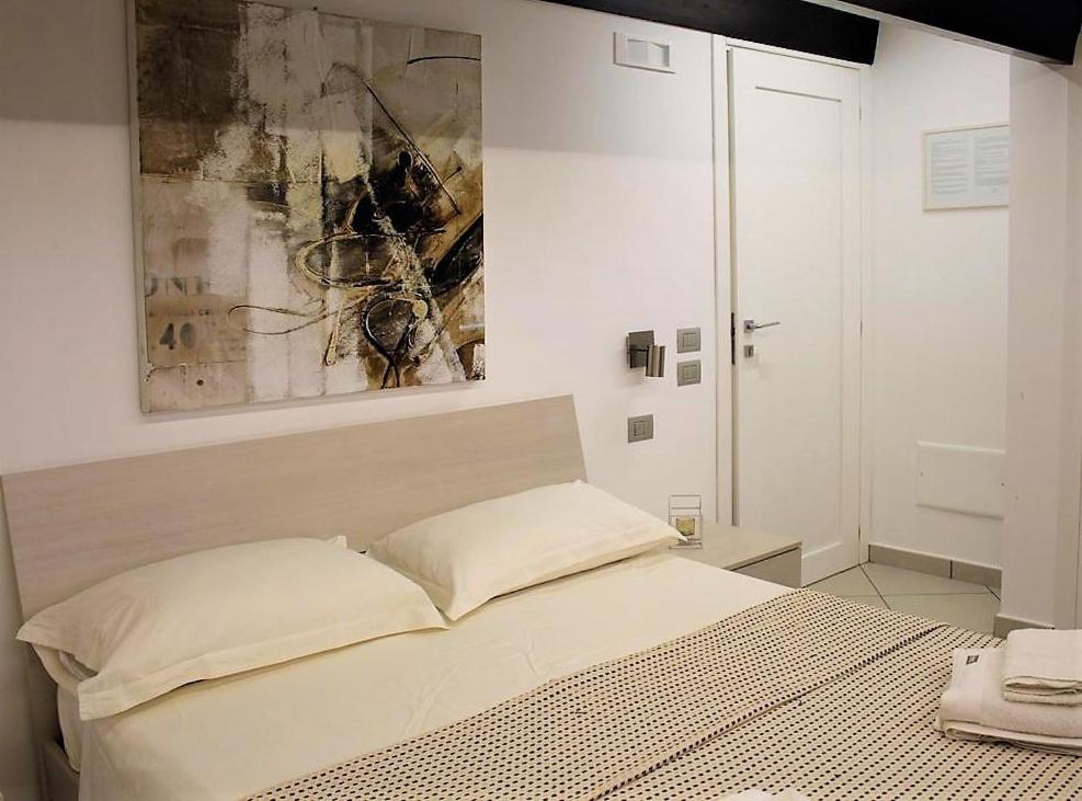Postel nebo postele na pokoji v ubytování Villa Treglia b&b