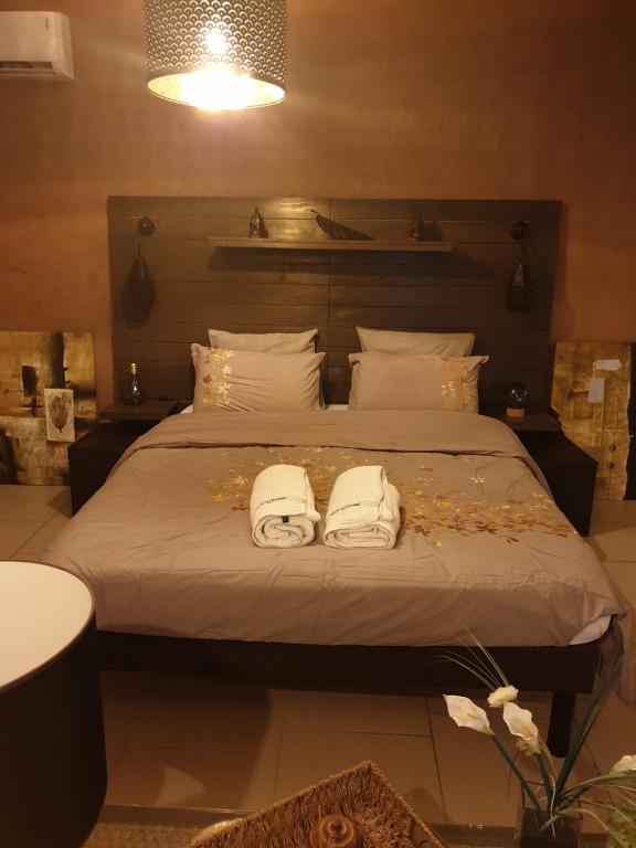 Кровать или кровати в номере Paradis Oriental