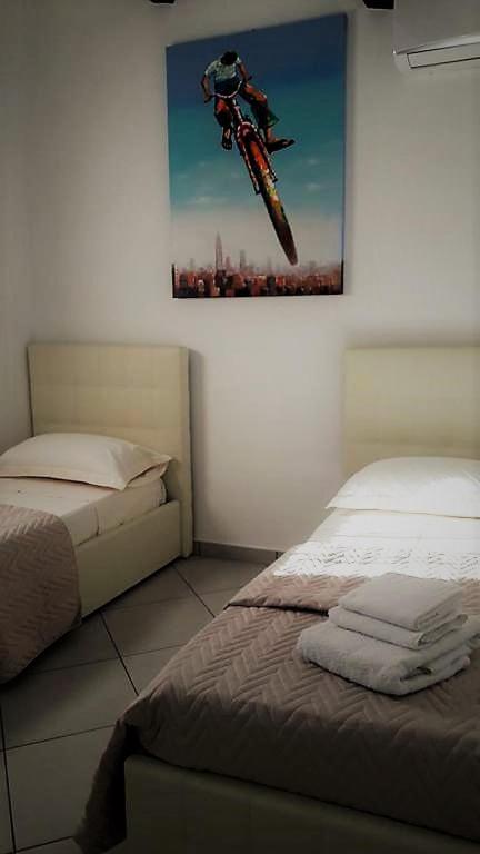 Postel nebo postele na pokoji v ubytování Villa Treglia b&b