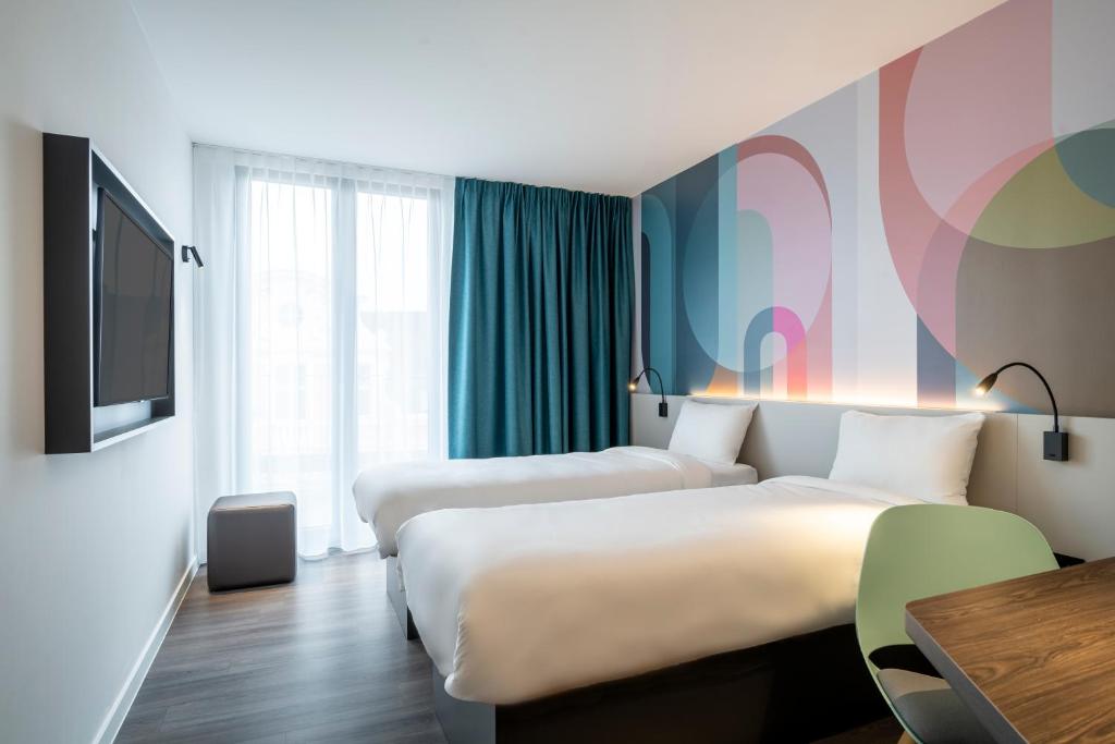 Postel nebo postele na pokoji v ubytování B&B HOTEL Gent Centrum
