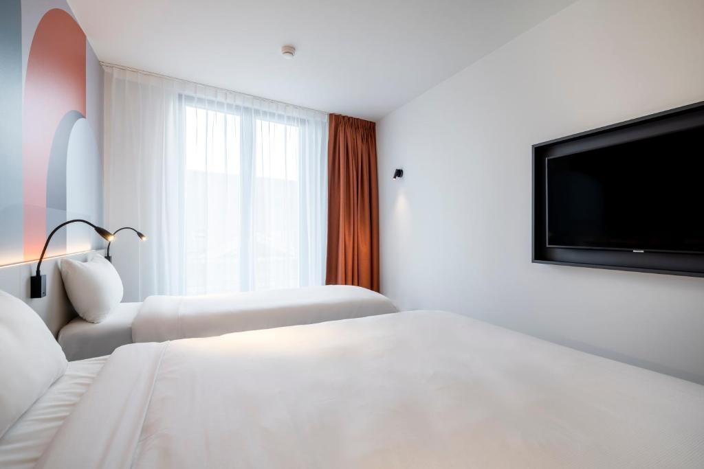 Postel nebo postele na pokoji v ubytování B&B HOTEL Gent Centrum