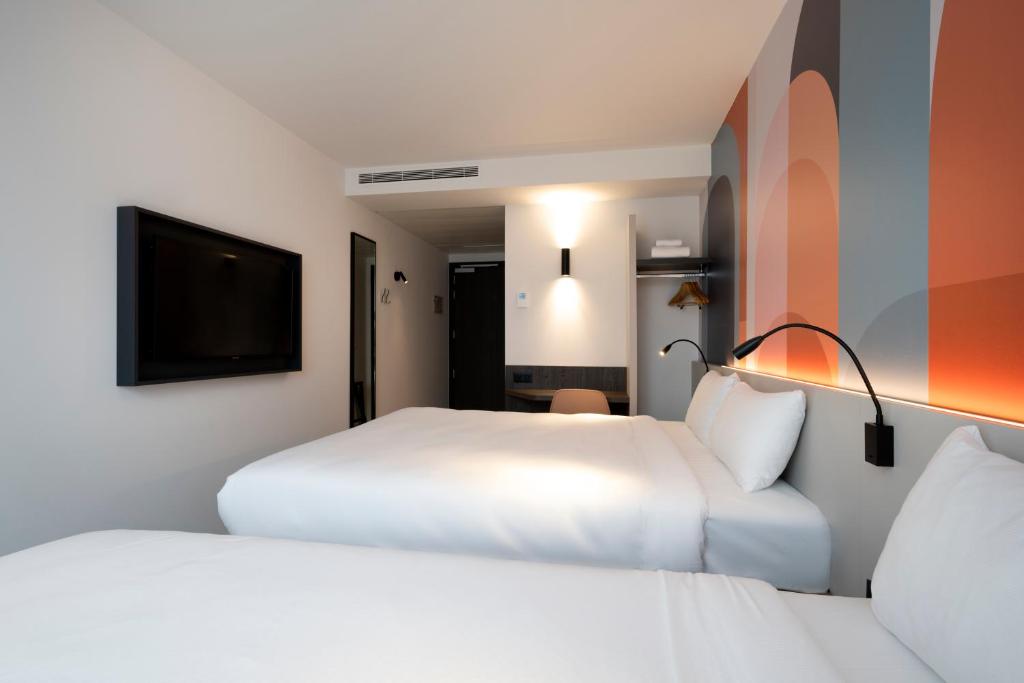 Postel nebo postele na pokoji v ubytování B&B HOTEL Gent Centrum
