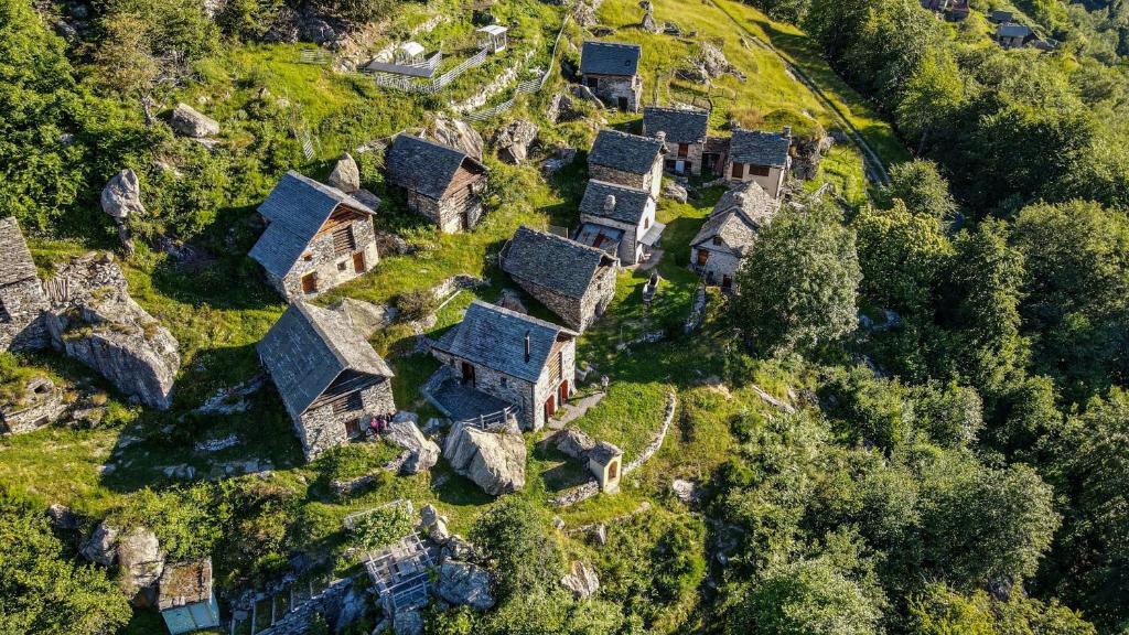 an aerial view of a village on the side of a mountain at Agri Scinghiöra in Brontallo