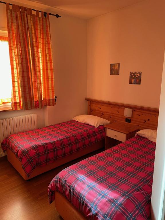 Postel nebo postele na pokoji v ubytování Hotel Culmine