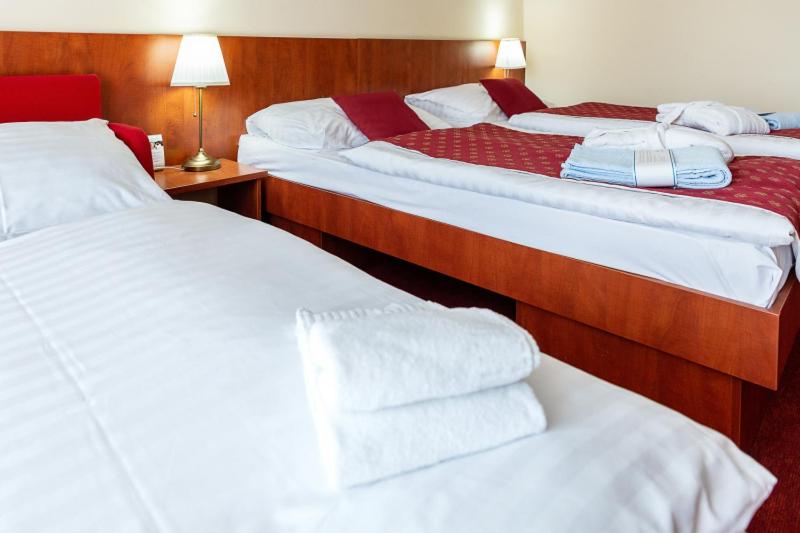 Postel nebo postele na pokoji v ubytování Hotel Senec Aqua Resort - Family friendly