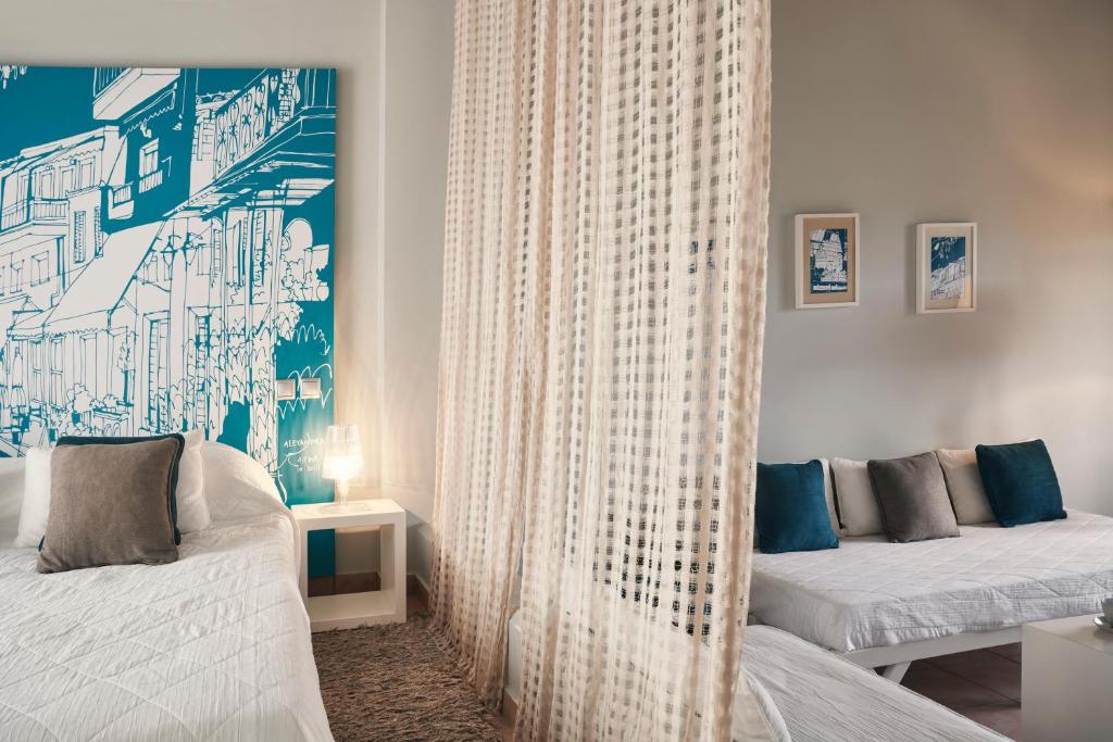 Postel nebo postele na pokoji v ubytování Angelina Boutique Escape