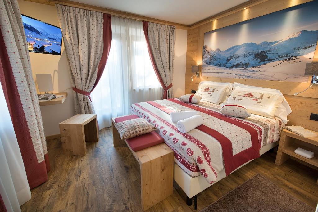 Postel nebo postele na pokoji v ubytování Hotel Bucaneve