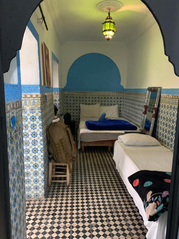 Postel nebo postele na pokoji v ubytování Riad Sijane