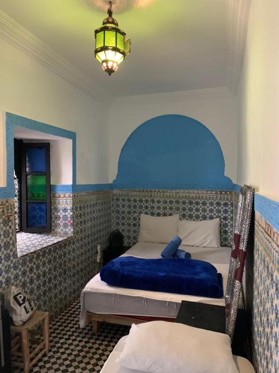 Postel nebo postele na pokoji v ubytování Riad Sijane
