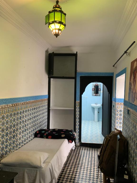 Postel nebo postele na pokoji v ubytování Riad Sijane