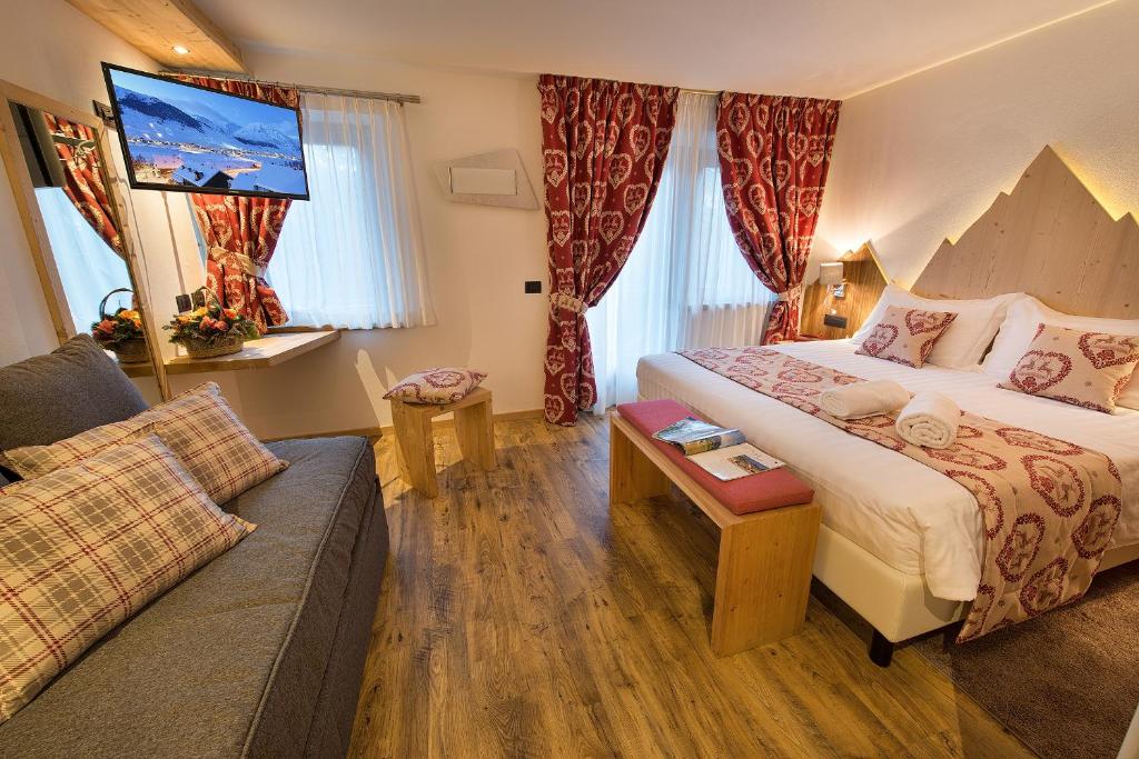 Postel nebo postele na pokoji v ubytování Hotel Bucaneve