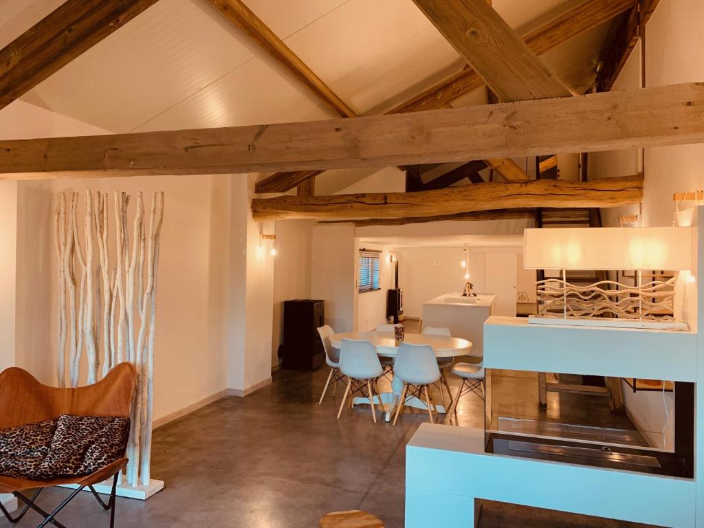 a kitchen and dining room with a table and chairs at MMGhome in Frasnes-lez-Anvaing