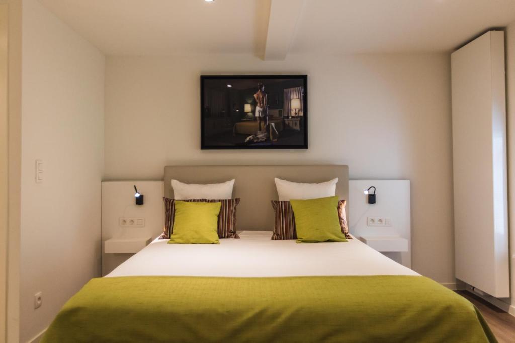 Postel nebo postele na pokoji v ubytování Hotel & Apartments Bibois Leuven