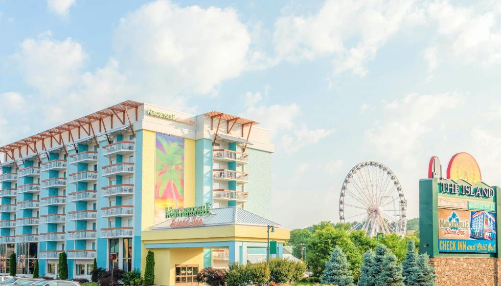 a large building with a clock on top of it at Margaritaville Island Inn in Pigeon Forge