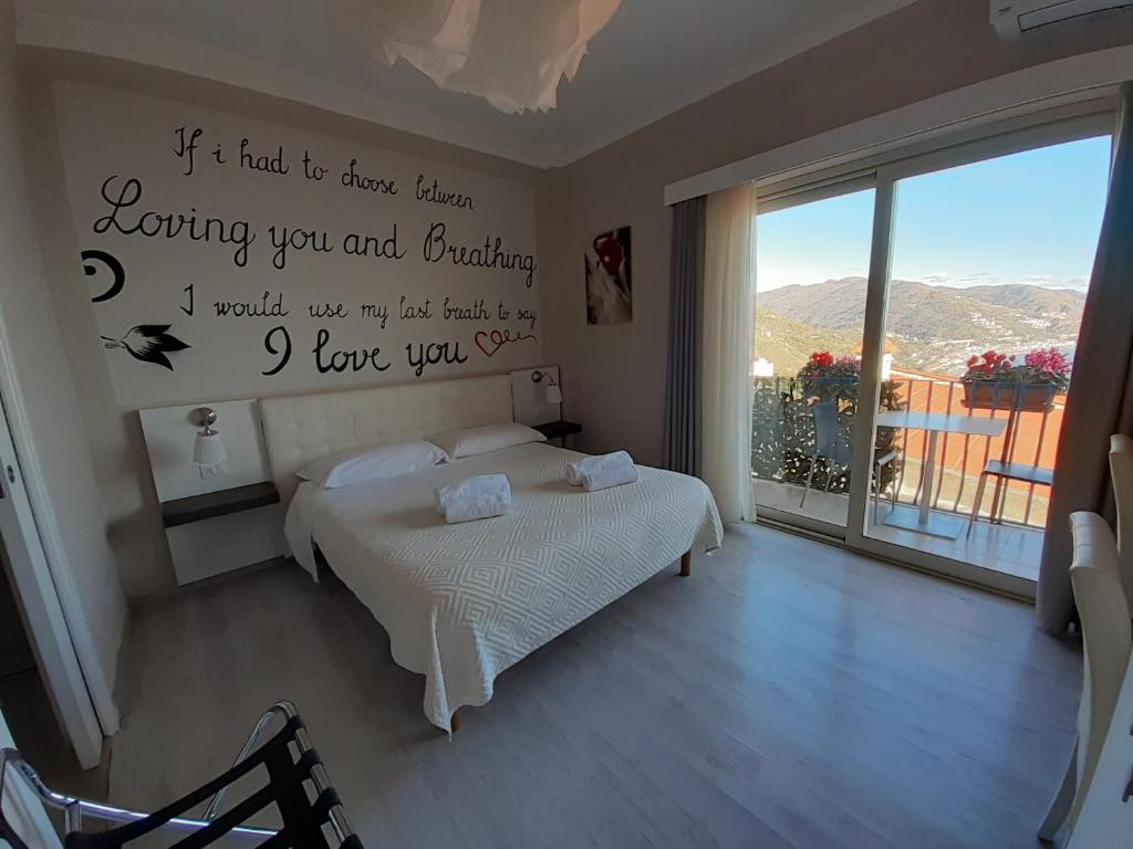 A bed or beds in a room at Athena Charming Rooms